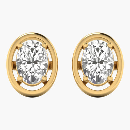 Gold earrings with clear gemstones on a white background