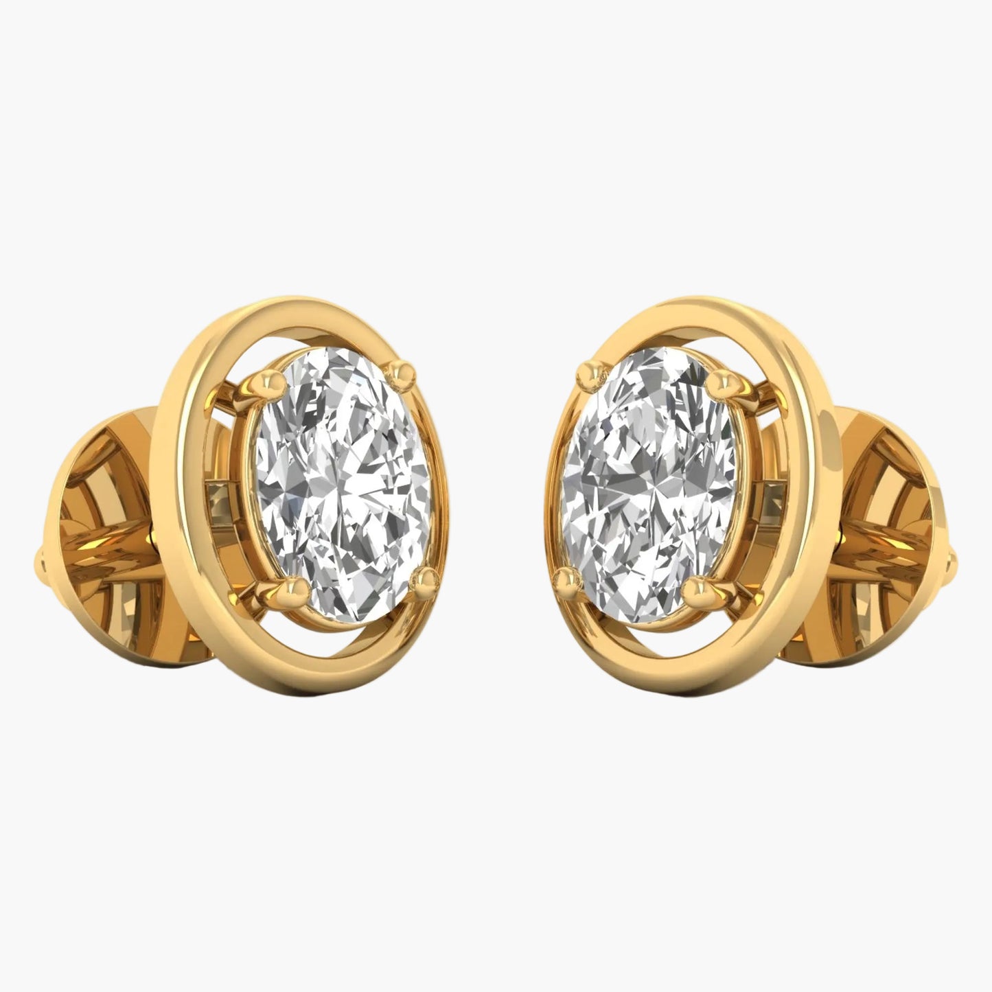 Gold earrings with clear gemstones on a white background