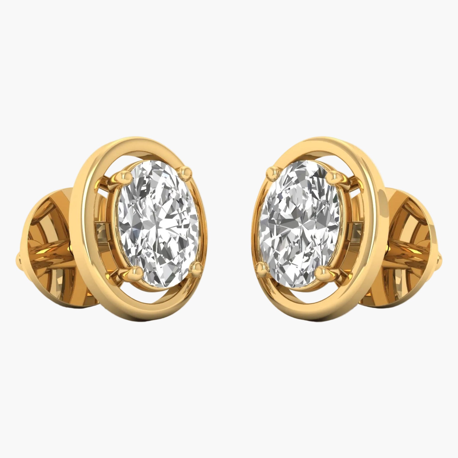 Gold earrings with clear gemstones on a white background