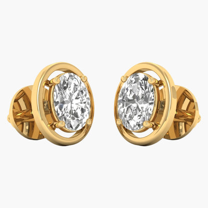 Gold earrings with clear gemstones on a white background