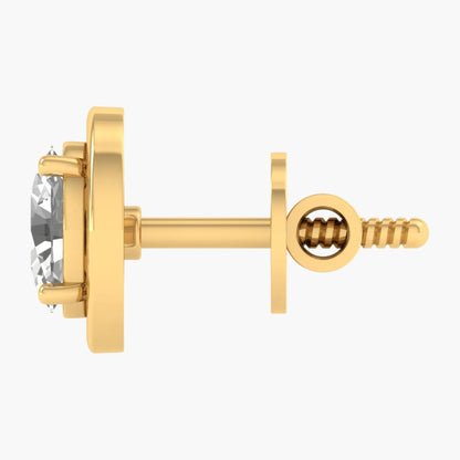 Gold earring with a clear gemstone on a white background