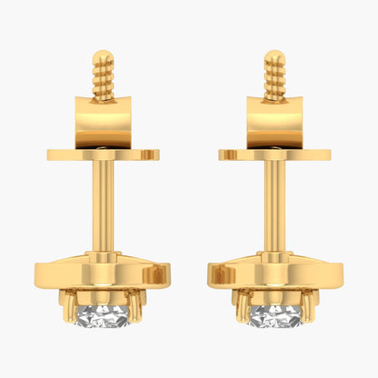 Pair of gold earrings with clear gemstones on a white background