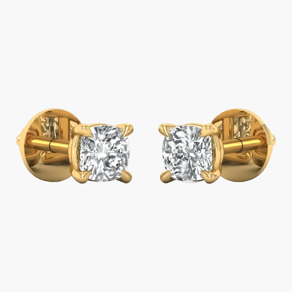 A pair of yellow gold stud earrings with cushion-cut diamond settings, shown from the side on a plain white background.