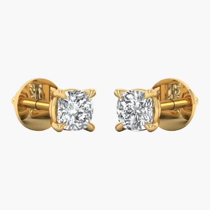 A pair of yellow gold stud earrings with cushion-cut diamond settings, shown from the side on a plain white background.