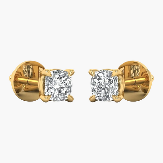 A pair of yellow gold stud earrings with cushion-cut diamond settings, shown from the side on a plain white background.