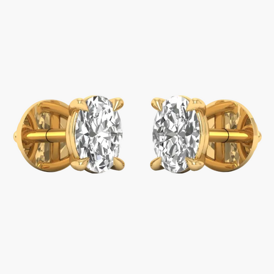 A pair of yellow gold stud earrings with oval-cut clear gemstones in a prong setting, shown on a plain white background with a faint 'GREAT LAB' watermark across the center.