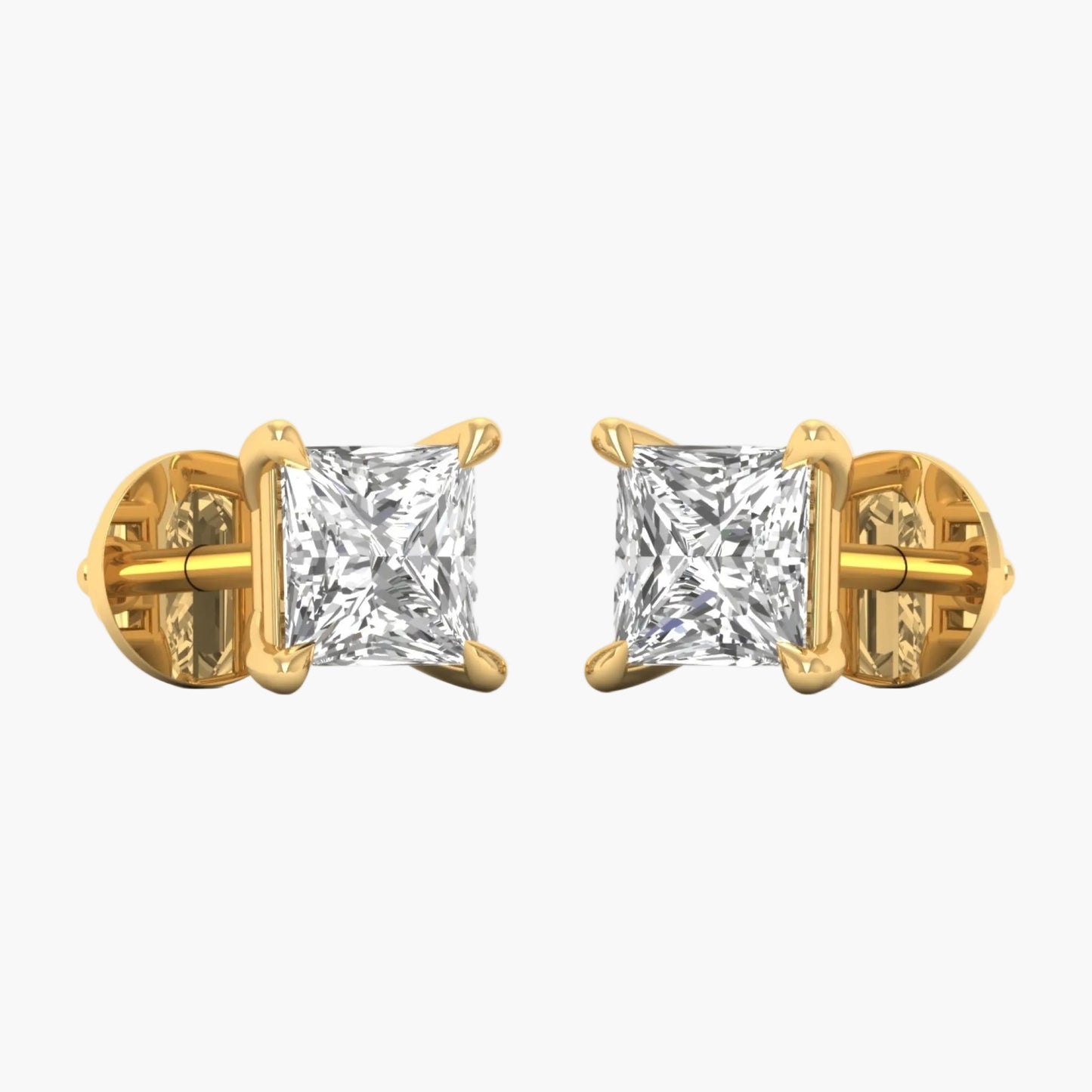 Gold earrings with clear gemstones on a white background