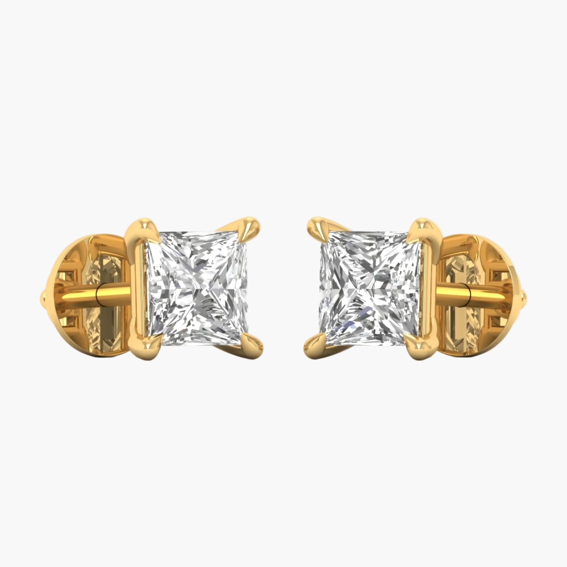 Gold earrings with clear gemstones on a white background