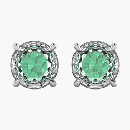 Pair of silver earrings with green gemstones on a white background