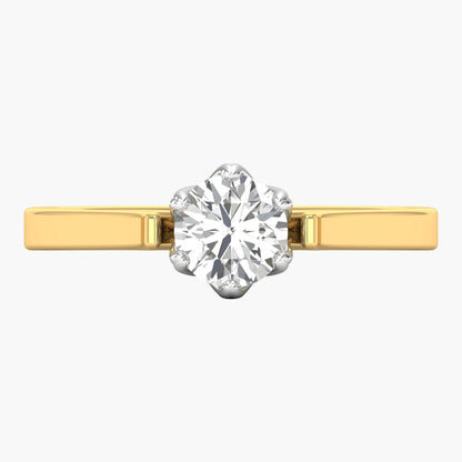 Gold ring with a large diamond on a white background