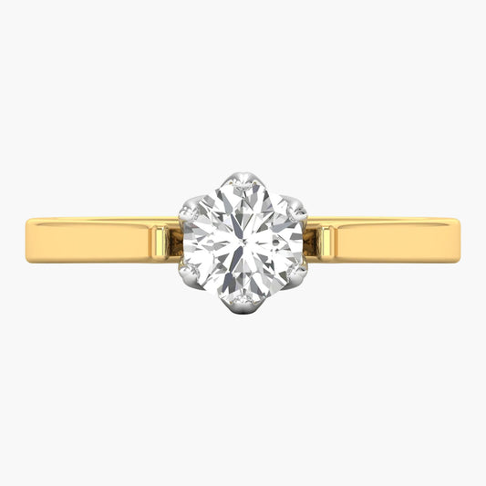 Gold ring with a large diamond on a white background
