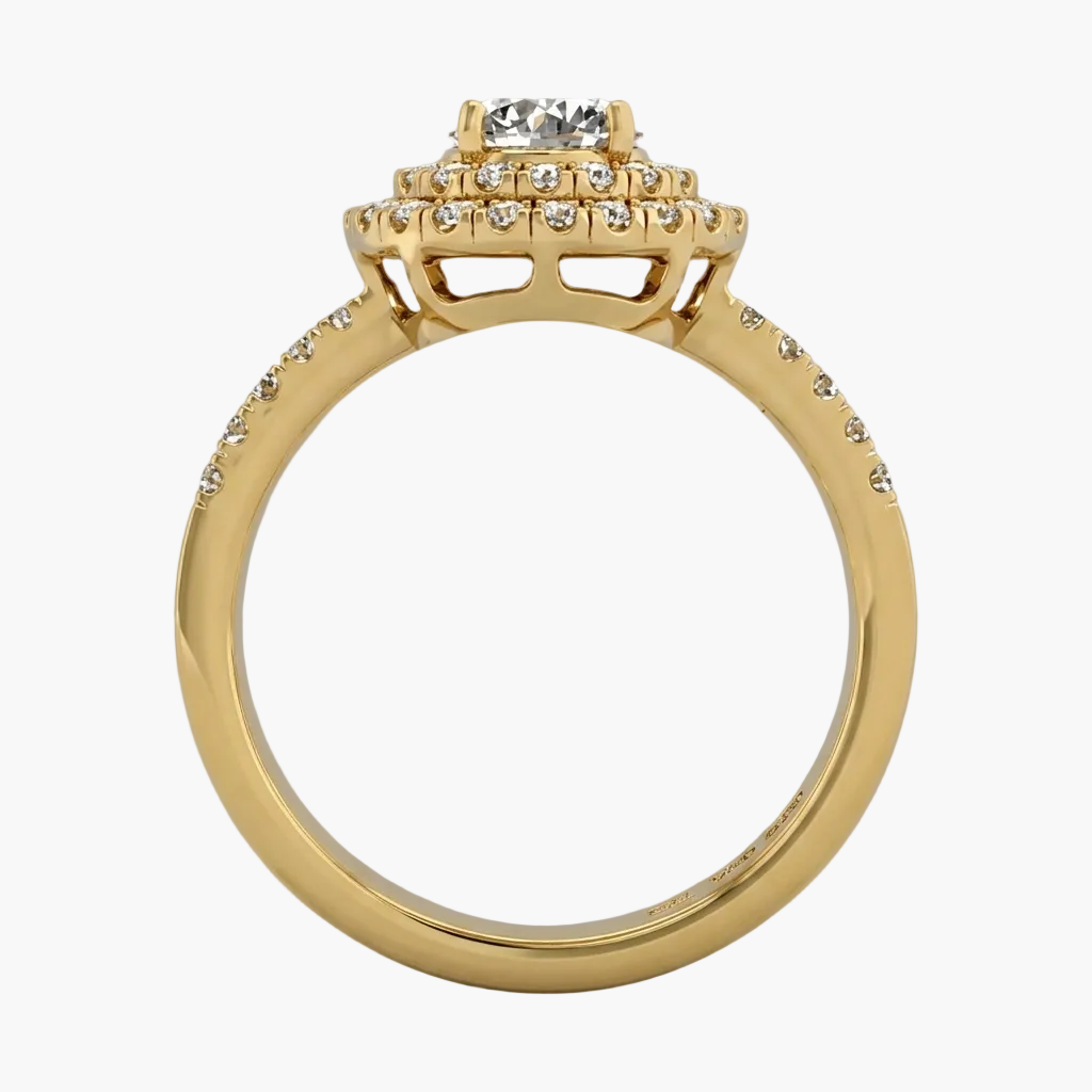 Gold ring with diamond accents on a gray background