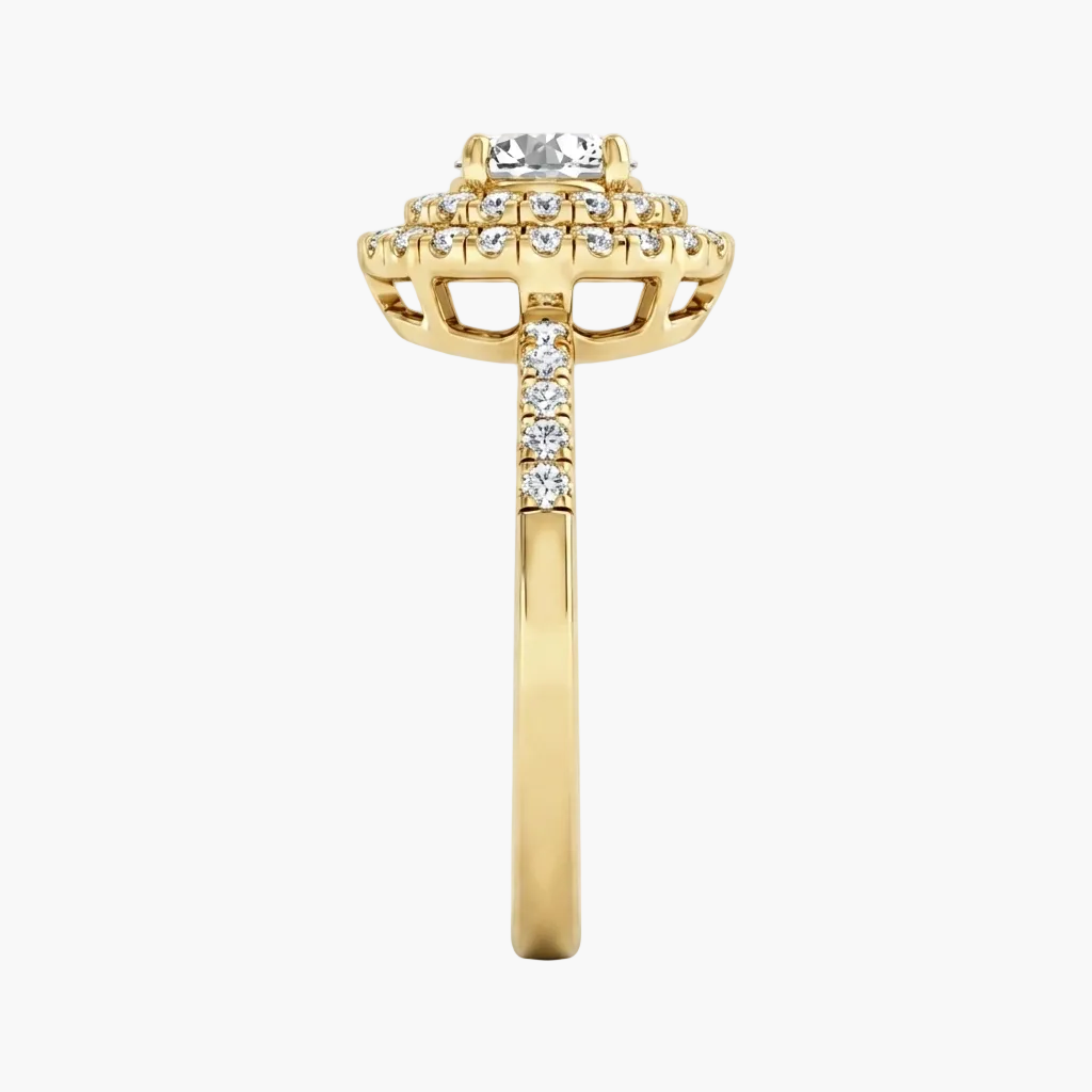 Gold ring with diamond accents on a white background