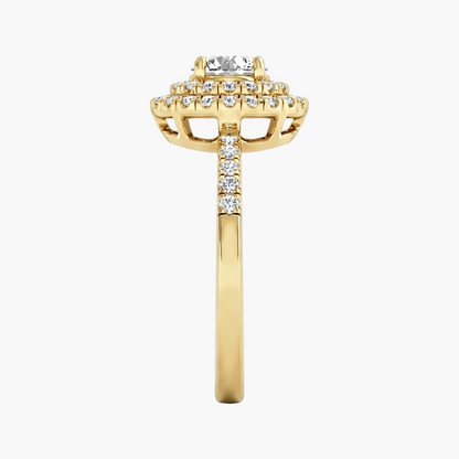 Gold ring with diamond accents on a white background