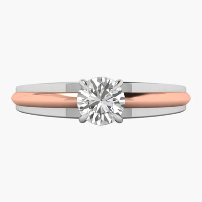 Two-tone ring with a diamond on a white background