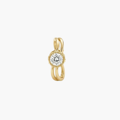 A gold ring featuring a central round-cut diamond surrounded by a delicate halo, with three curved bands wrapping around it, set against a clean white background.