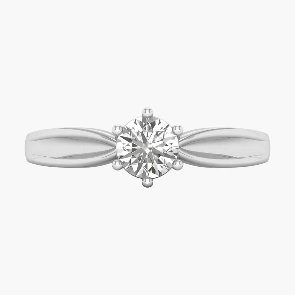 Silver bracelet with heart and circle charms on a white background
