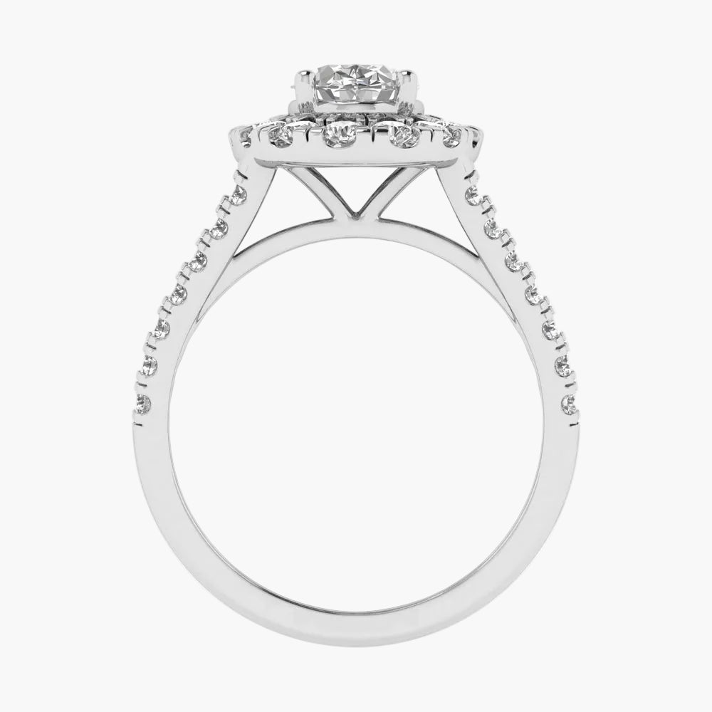 Diamond ring with a halo-style setting on a white background