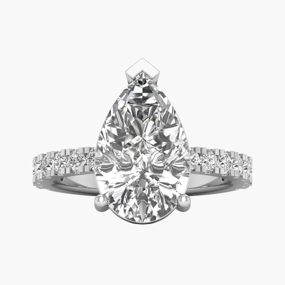 Diamond ring with pear-shaped center stone on a white background