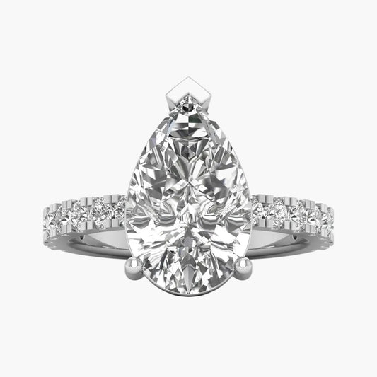 Diamond ring with pear-shaped center stone on a white background