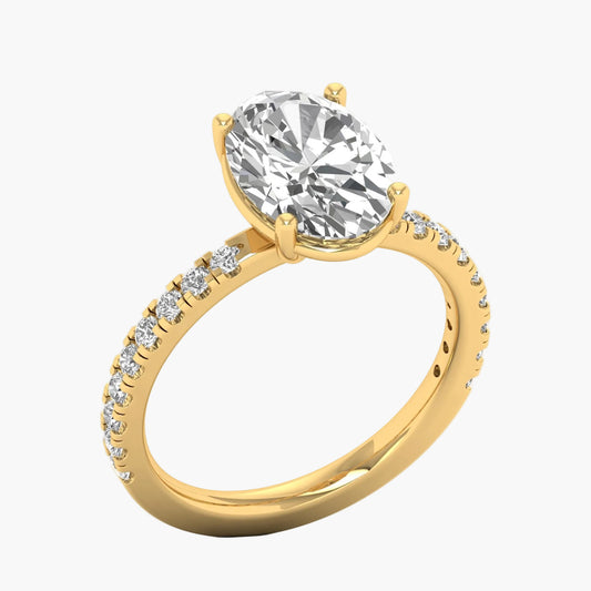 Gold ring with a large diamond and smaller diamonds on the band against a white background