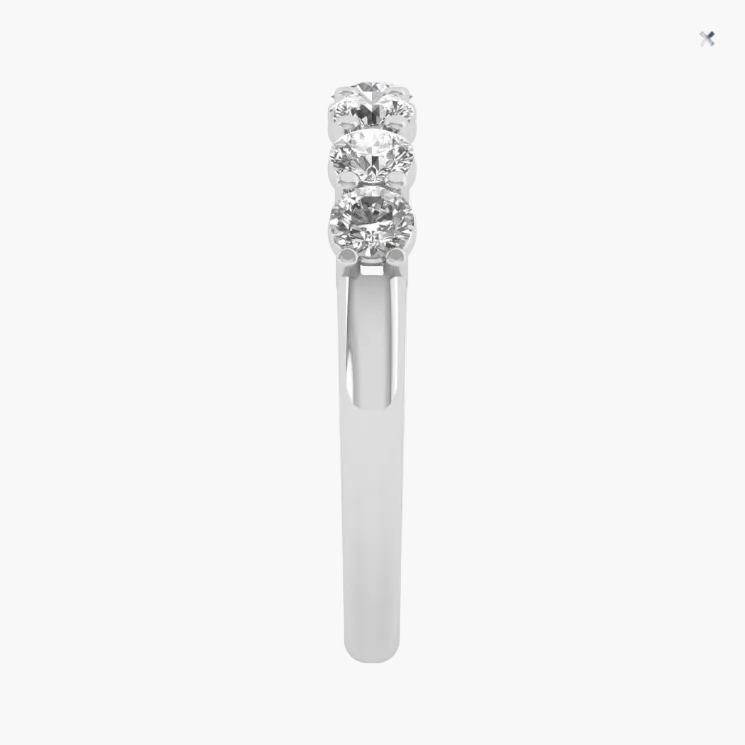 A white gold or platinum ring featuring three stacked round-cut clear gemstones in a prong setting, shown against a plain white background.