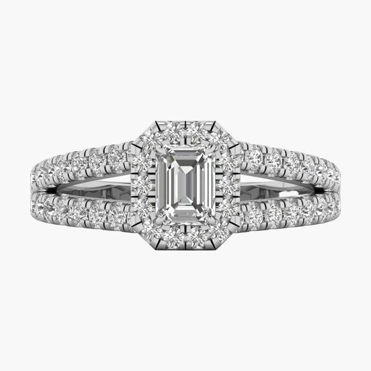 Diamond ring with emerald-cut center stone on a white background