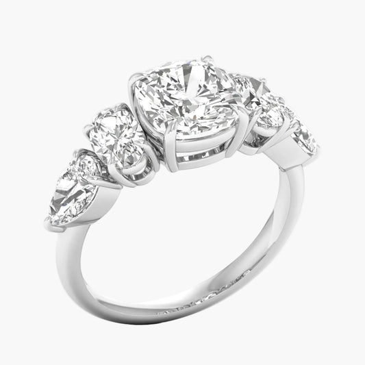 Diamond ring with four smaller diamonds on a white background