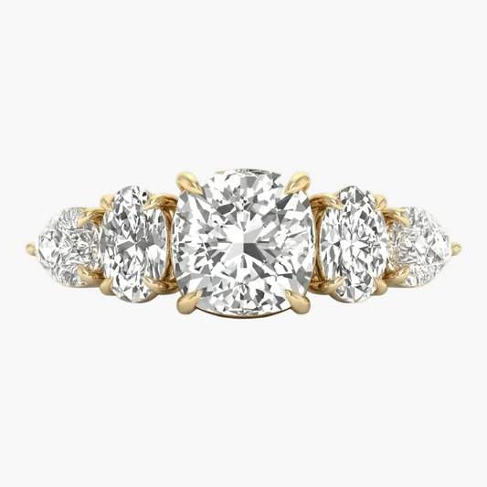 Gold ring with multiple diamonds on a white background