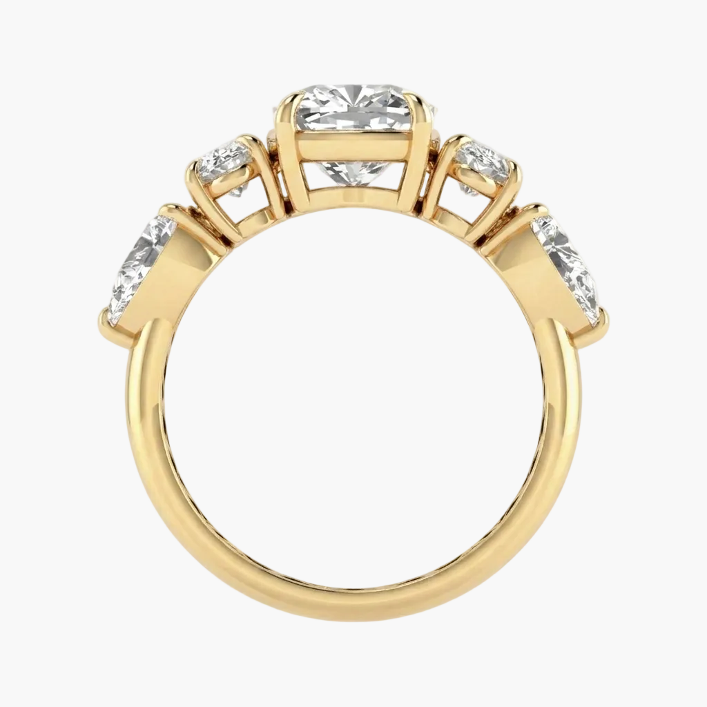 Gold ring with clear gemstones on a white background