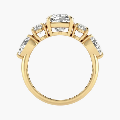 Gold ring with clear gemstones on a white background
