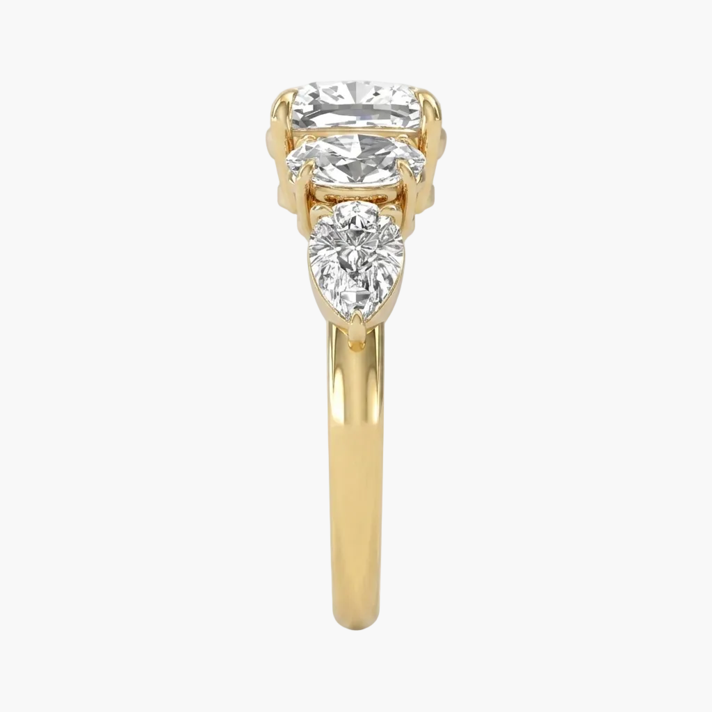 Gold ring with three diamonds on a white background