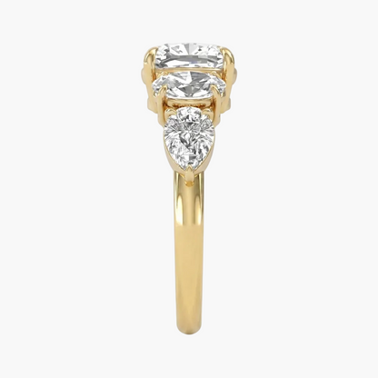 Gold ring with three diamonds on a white background