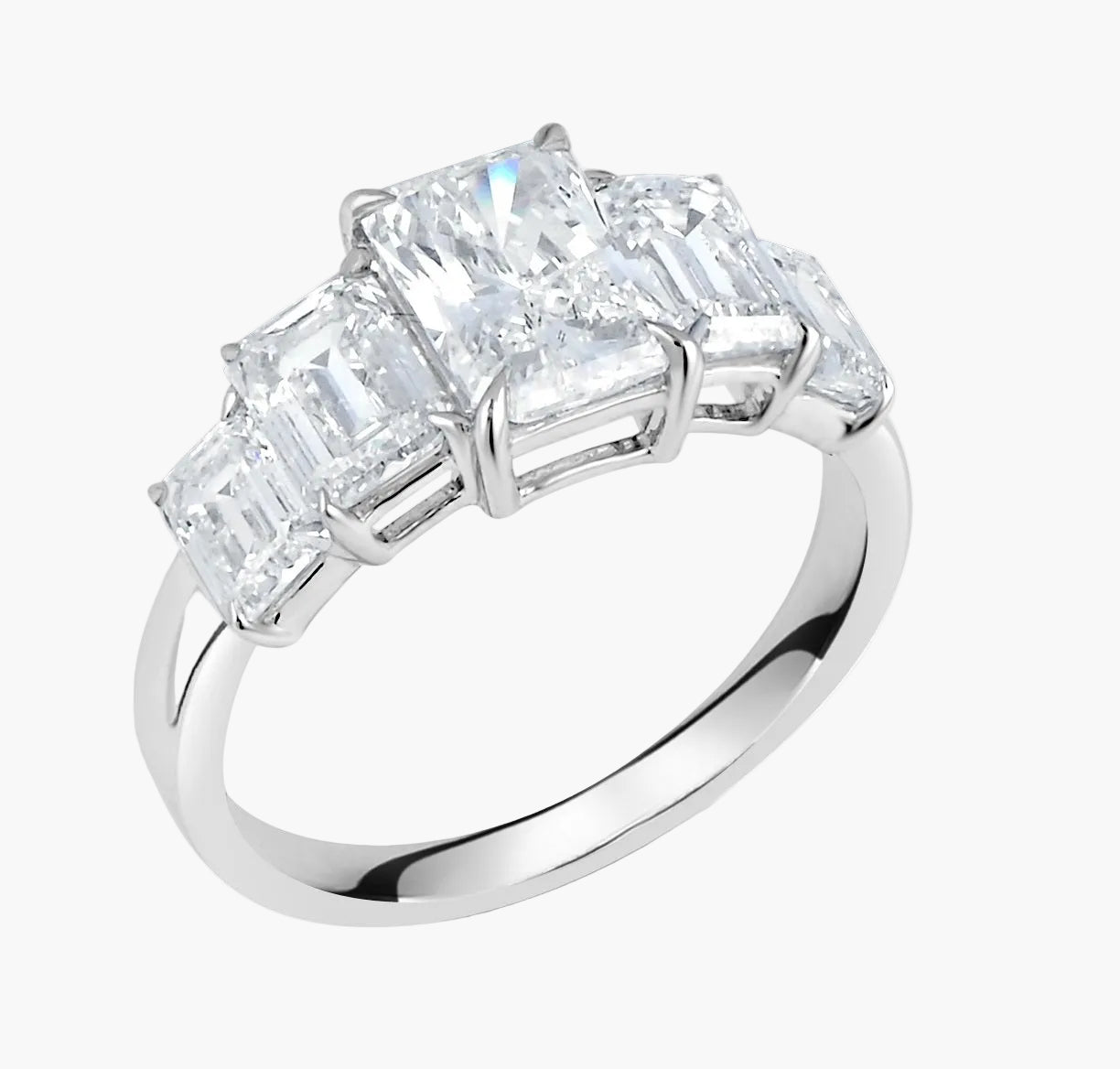 Diamond ring with four-prong setting on a white background