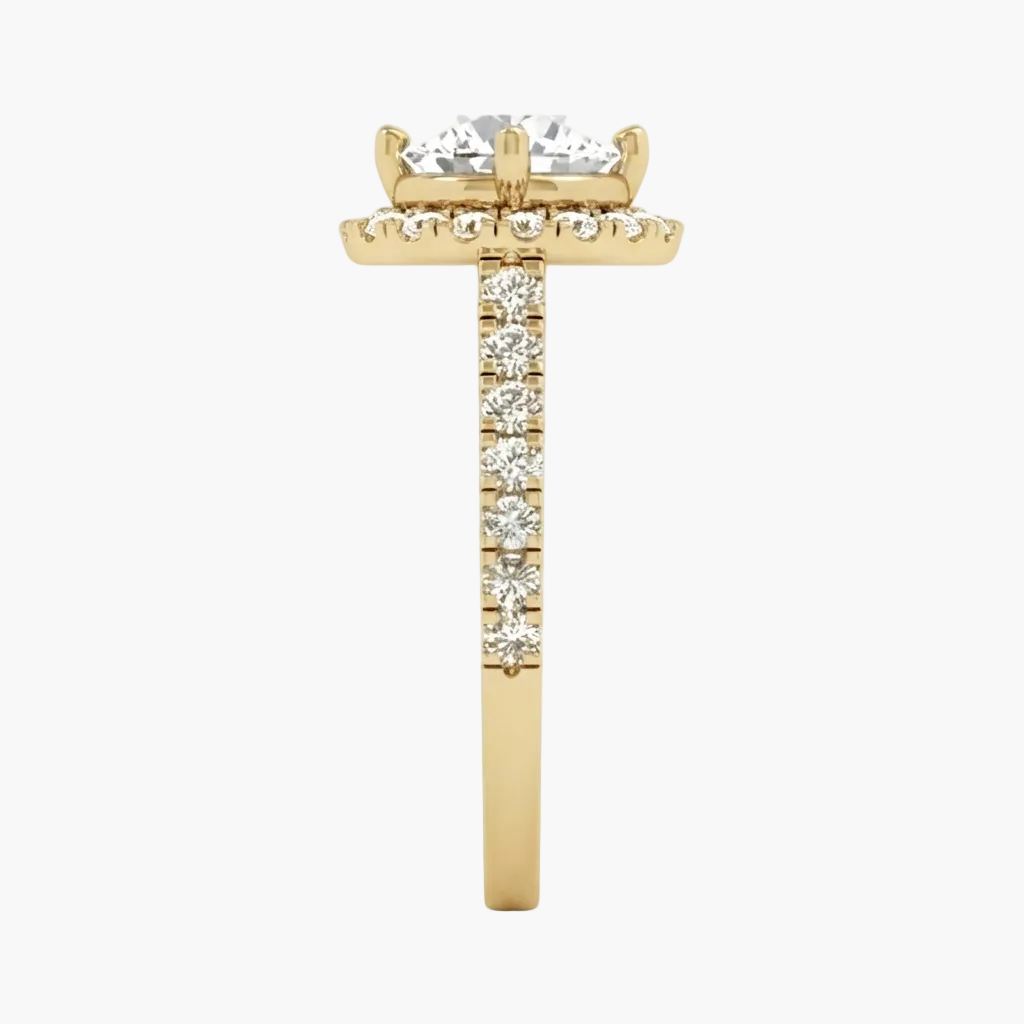 A yellow gold ring featuring a large round-cut diamond center stone, a halo of small diamonds, and a pavé diamond band, shown on a plain white background.