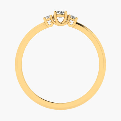 Gold ring with three diamond-like stones on a white background