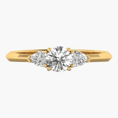 Gold ring with three diamonds on a white background