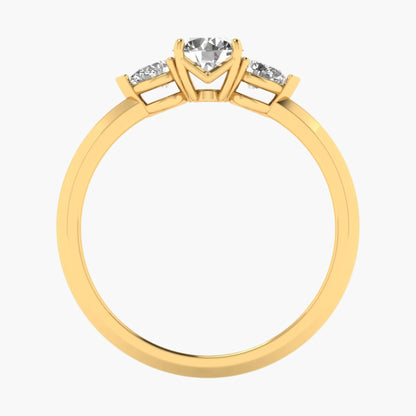 Gold ring with a heart-shaped diamond on a white background
