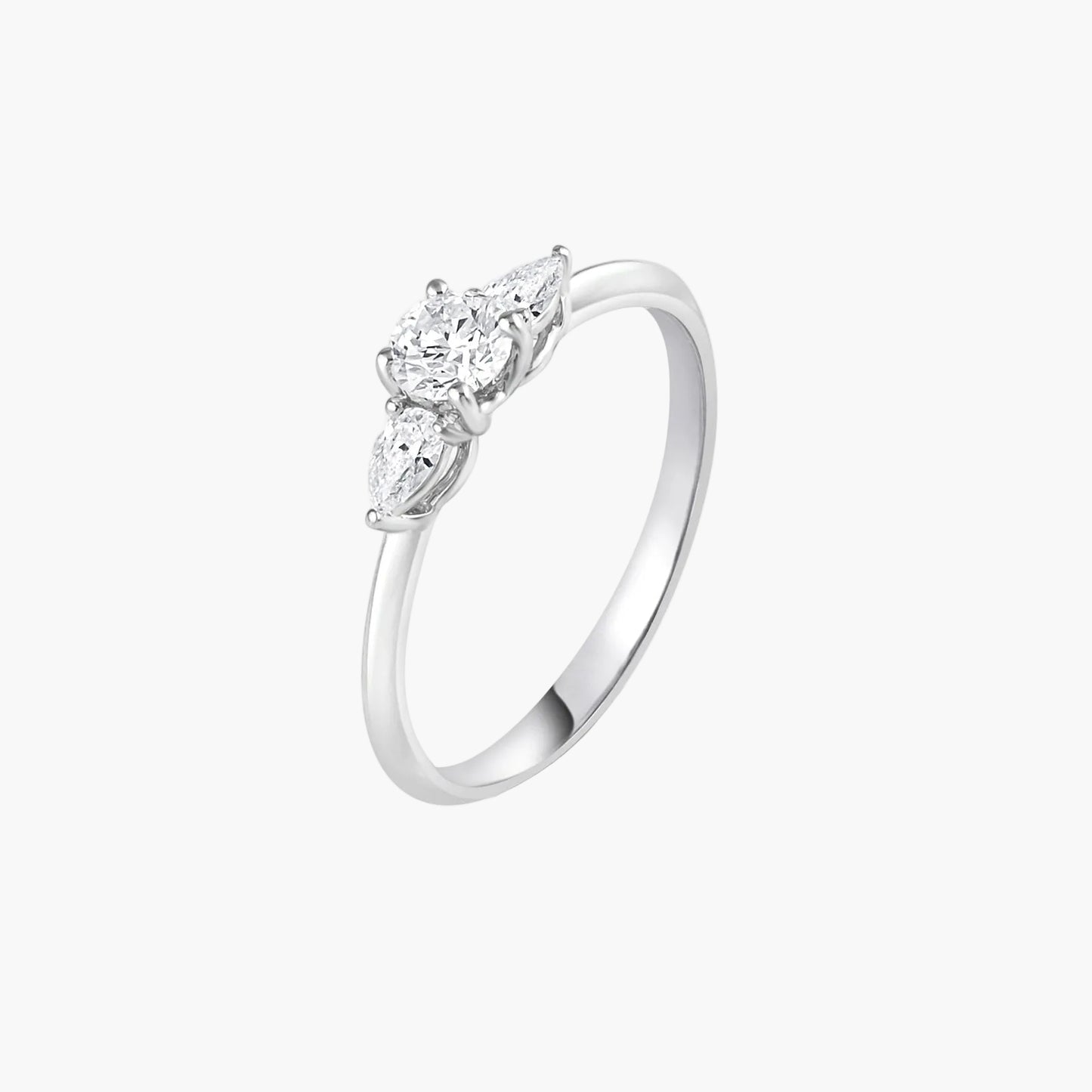 Silver ring with three diamond stones on a white background