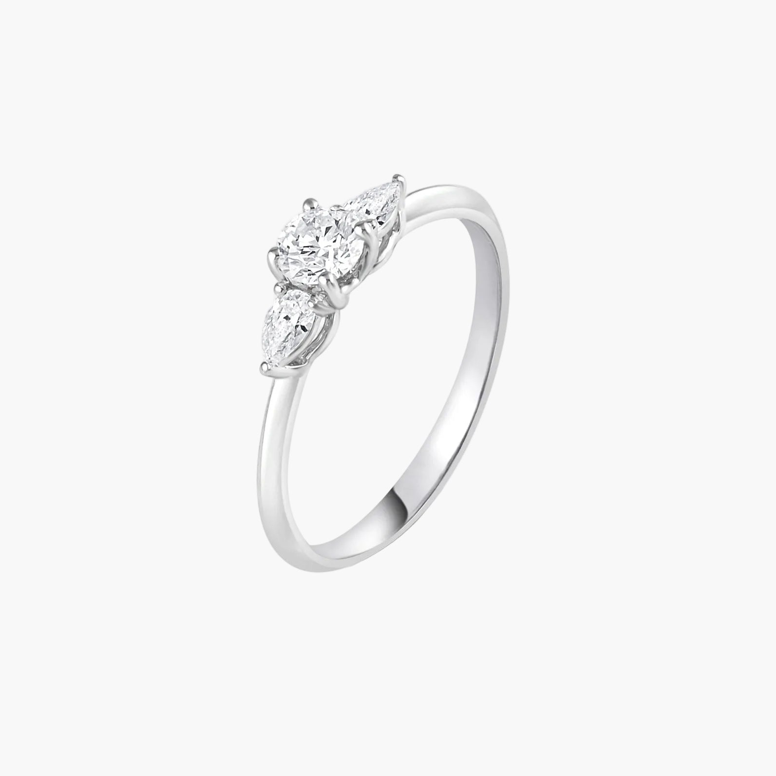 Silver ring with three diamond stones on a white background