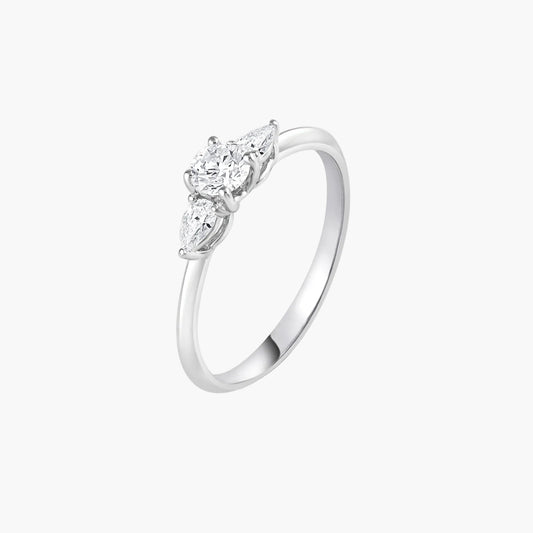 Silver ring with three diamond stones on a white background