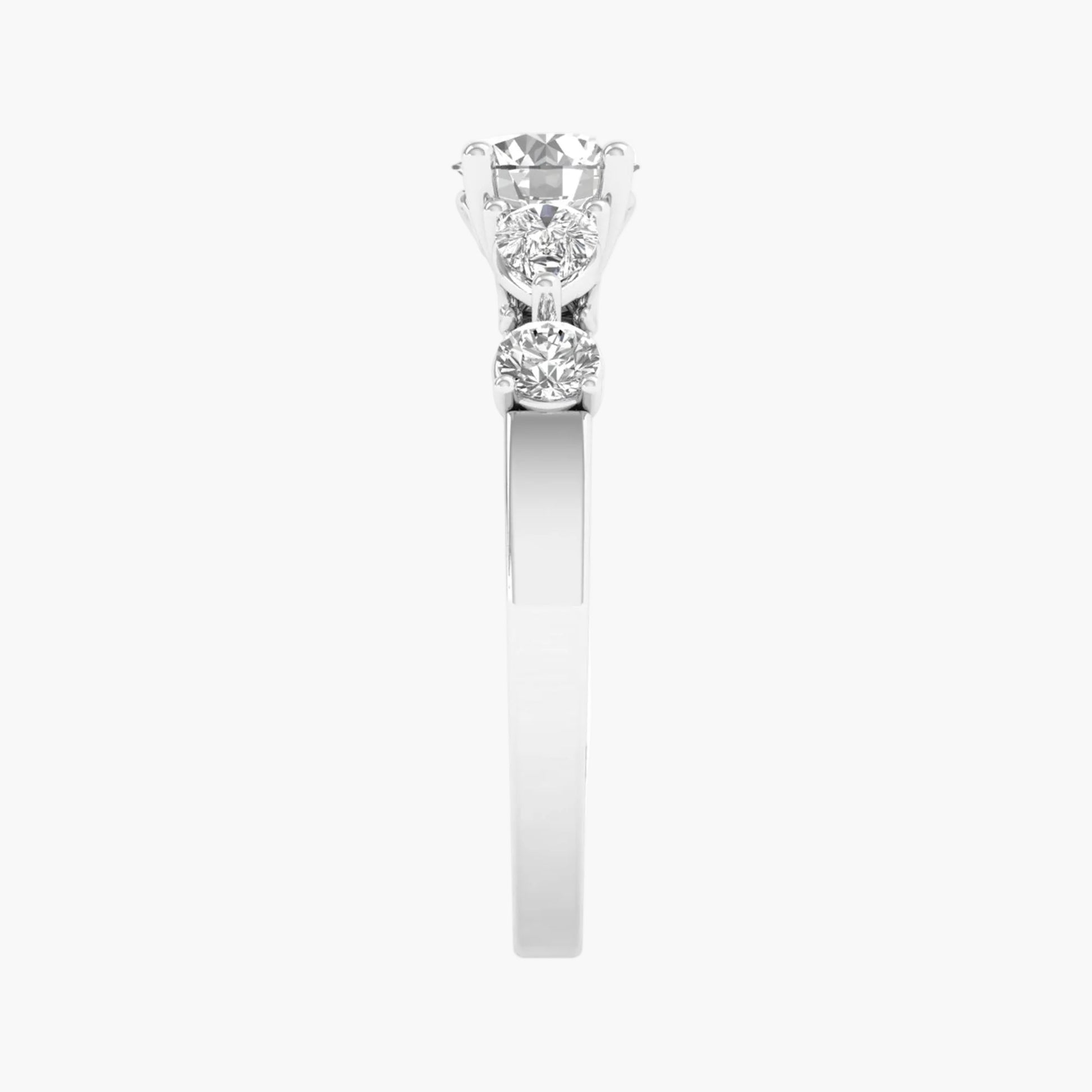 Diamond ring with three stones on a white background