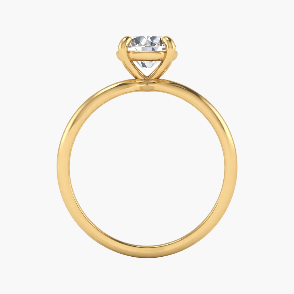 Gold ring with a heart-shaped diamond on a white background