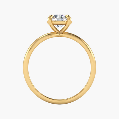 Gold ring with a heart-shaped diamond on a white background