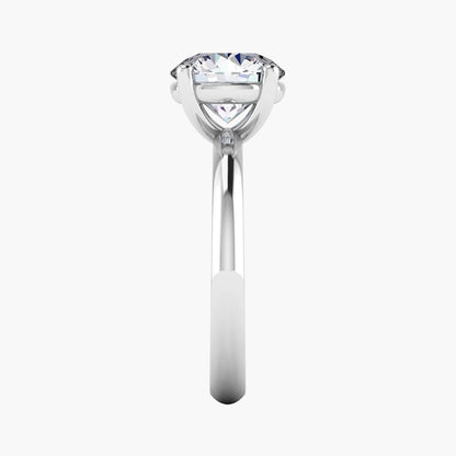 Silver ring with a clear gemstone on a white background
