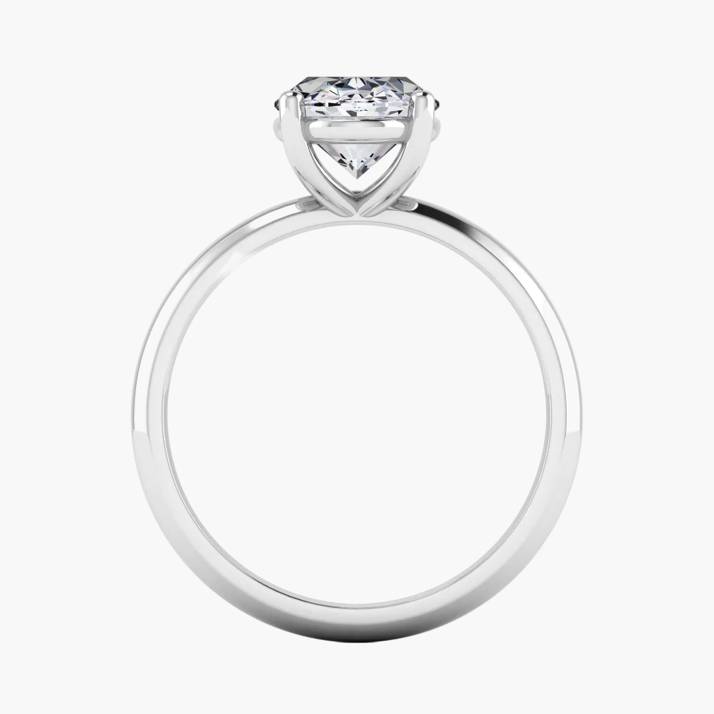 Silver ring with a heart-shaped diamond on a white background