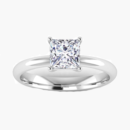 Silver ring with a princess-cut diamond on a white background