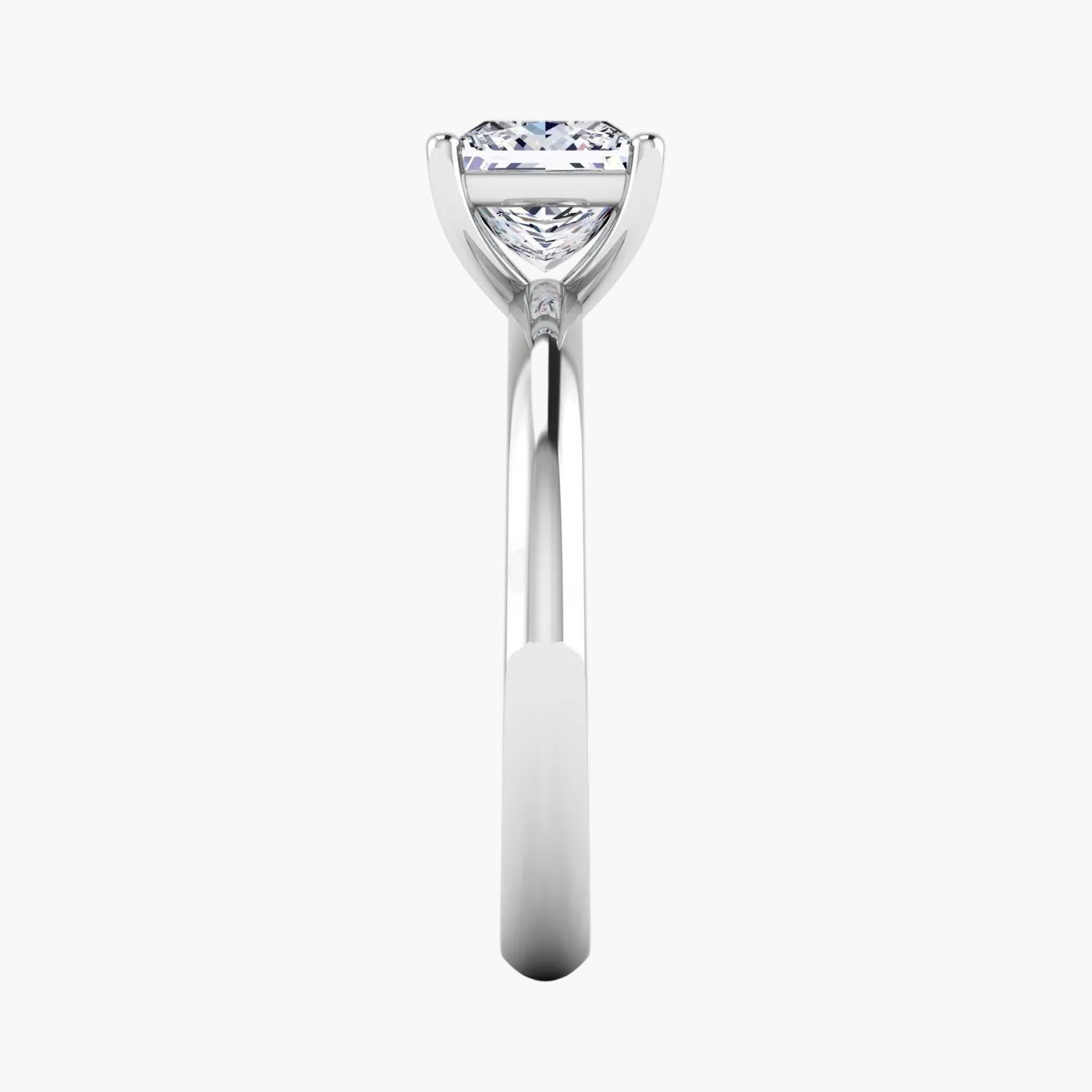 Diamond ring with a triangular cut gemstone on a white background