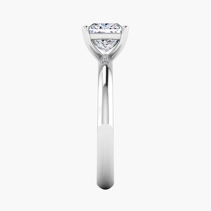 Diamond ring with a triangular cut gemstone on a white background
