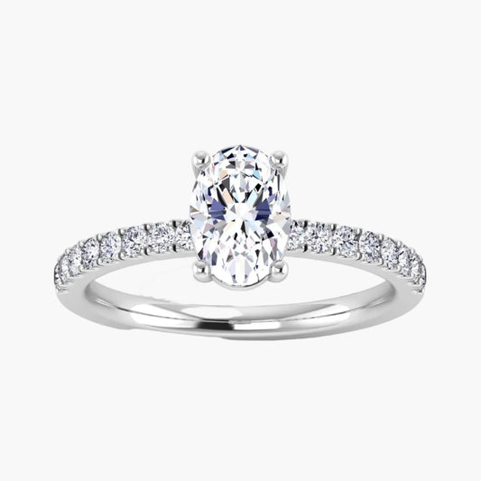 Diamond ring with a central oval-cut diamond and smaller diamonds on the band against a white background